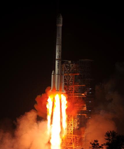 The Chang'e-3 rocket carrying the Jade Rabbit rover blasts off around 1:30 am (Sunday 1730 GMT) into the dark sky, from the Xichang Satellite Launch Center in the southwest province of Sichuan on December 2, 2013