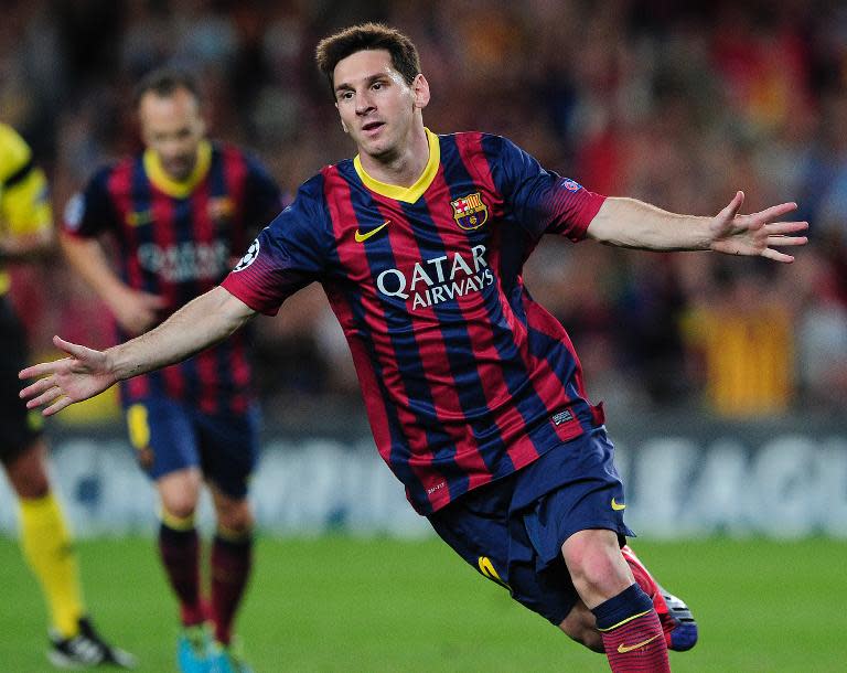 Lionel Messi celebrates after scoring against Ajax Amsterdam at Camp Nou stadium in Barcelona on September 18, 2013