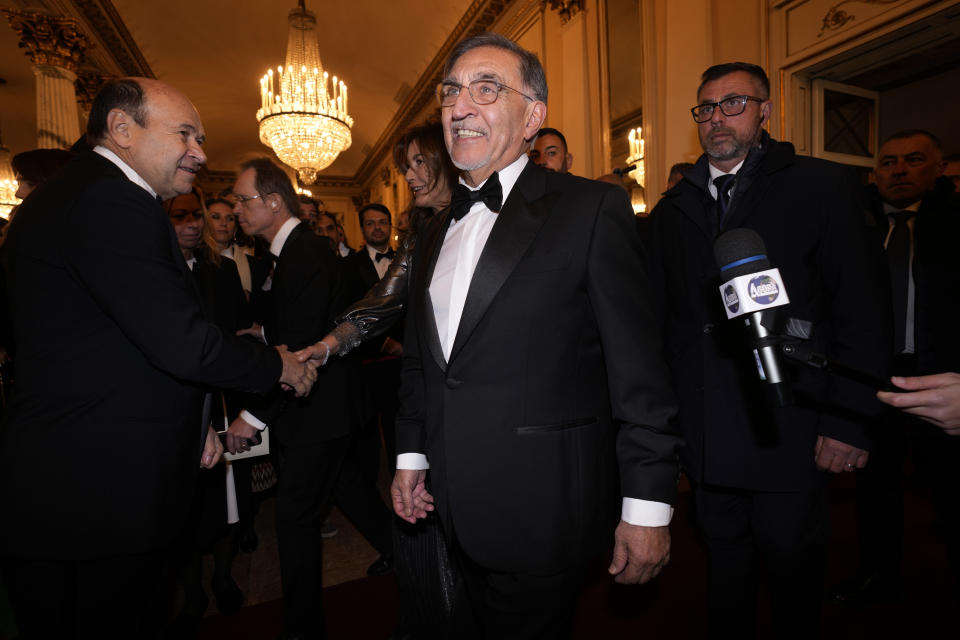 Italian Senate President Ignazio La Russa arrives for the premiere of Modest Mussorgsky's Boris Godunov in Milan, Italy, Wednesday, Dec. 7, 2022. Italy’s most famous opera house, Teatro alla Scala, opened its new season Wednesday with the Russian opera “Boris Godunov,” against the backdrop of Ukrainian protests that the cultural event is a propaganda win for the Kremlin during Russia’s invasion of Ukraine. (AP Photo/Antonio Calanni)