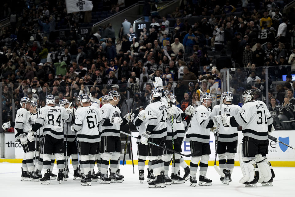 Los Angeles Kings celebrate a win over the San Jose Sharks in an NHL hockey game Wednesday, Dec. 27, 2023, in Los Angeles. (AP Photo/Kyusung Gong)