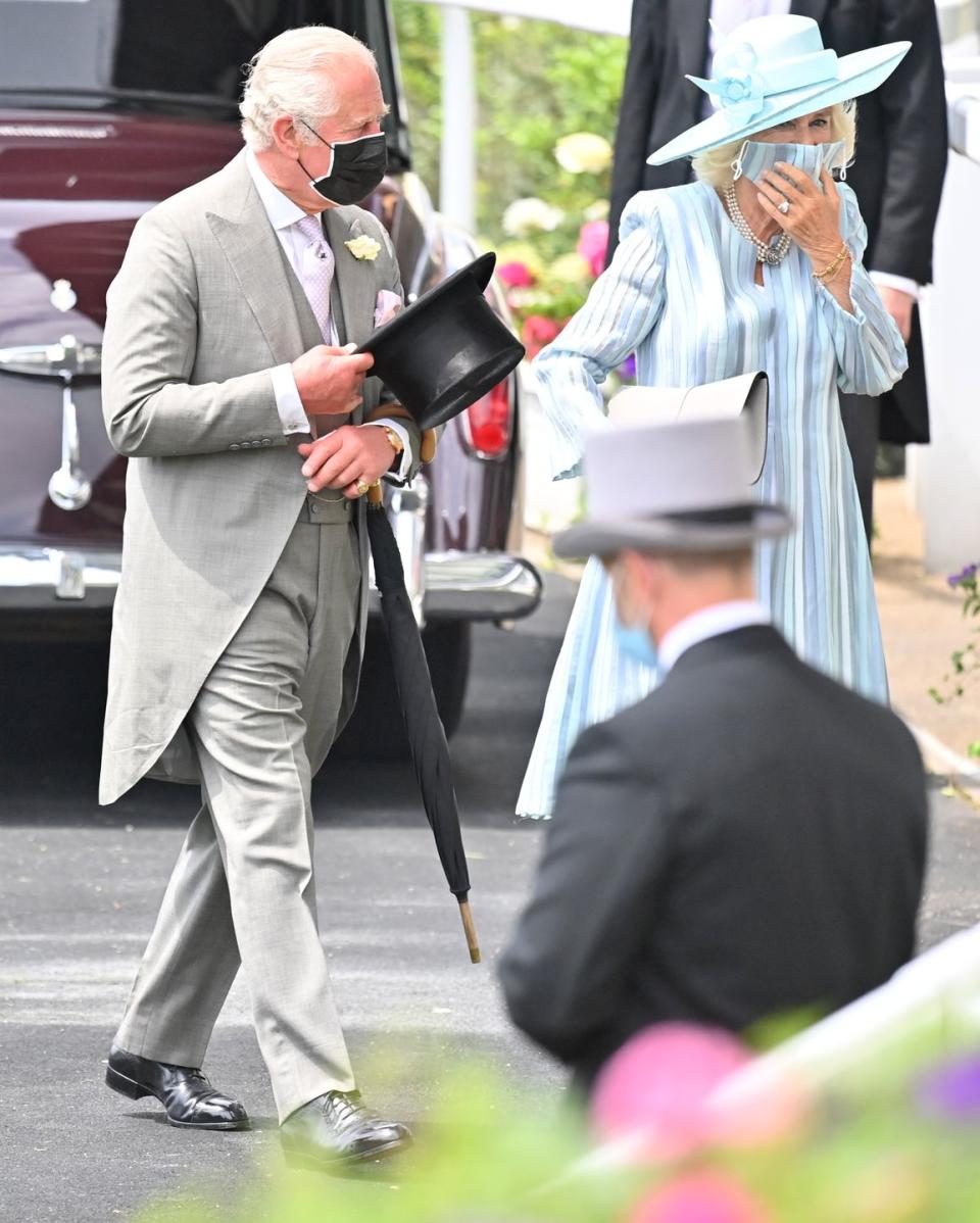 <p>The Prince of Wales and Duchess of Cornwall walking into Ascot Racecourse, all masked up and ready to watch the event.</p>