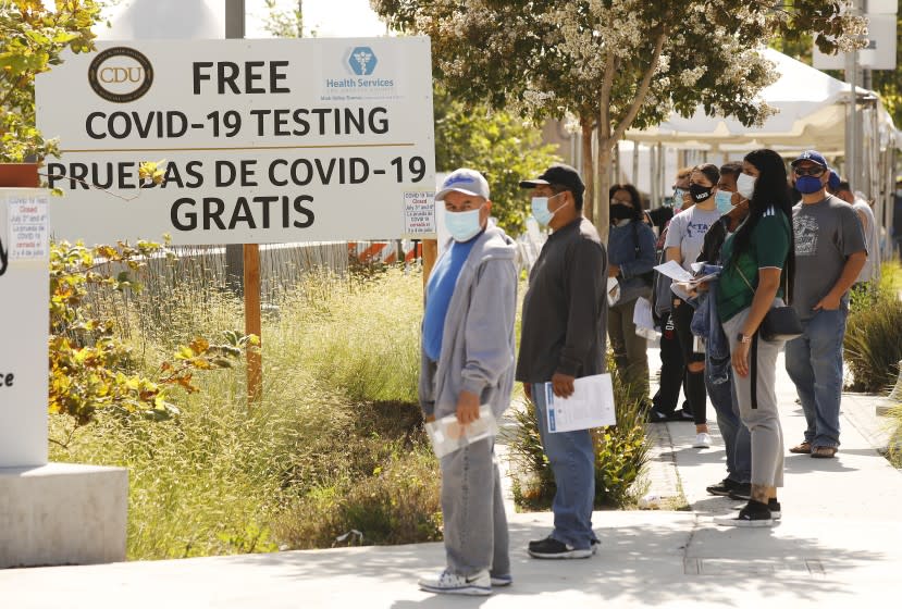 LOS ANGELES, CA - JULY 08: Walk-ins wait for Coronavirus Covid-19 testing in LA County at the Charles R. Drew University of Medicine and Science in South Los Angeles on July 8, 2020 as California records its highest single-day coronavirus death toll with 149 fatalities reported. The Charles R. Drew University site has tested a large number of people from racial and ethnic minority groups that are at higher risk for poor outcomes and complications from COVID-19. Drew University on Wednesday, July 8, 2020 in Los Angeles, CA. (Al Seib / Los Angeles Times)