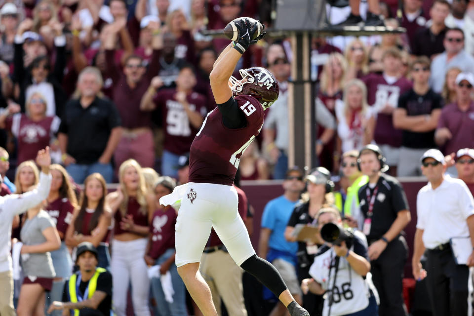 COLLEGE STATION, TEXAS – OCTOBER 07: Jake Johnson #19 of the Texas A&M Aggies catches a pass for a touchdown in the first half against the Alabama Crimson Tide at Kyle Field on October 07, 2023 in College Station, Texas. (Photo by Tim Warner/Getty Images)