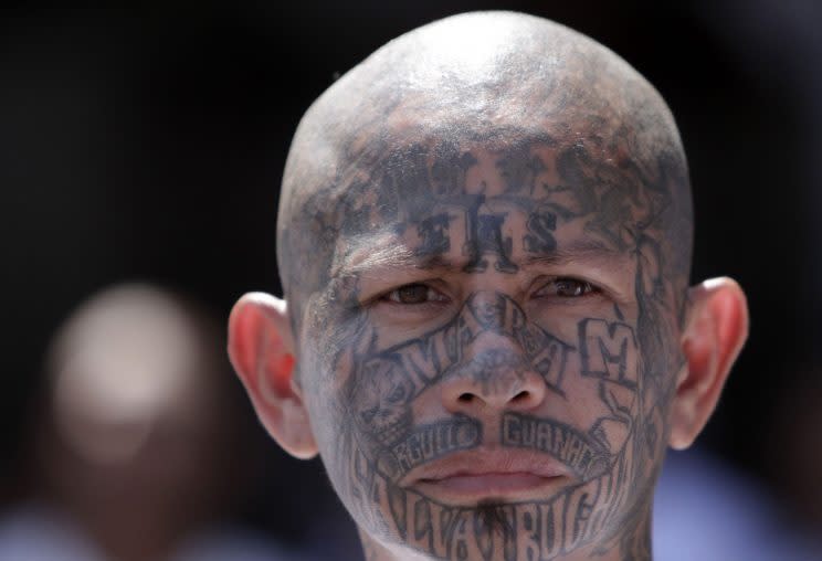 The country's gangs are known by their elaborate and symbolic tattoos (Rex)