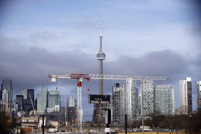 OTTAWA — Canada Mortgage and Housing Corporation says the country’s overall real estate market remains “vulnerable” despite an easing in overvaluation in cities like Toronto and Victoria in the third quarter. (The Canadian Press)