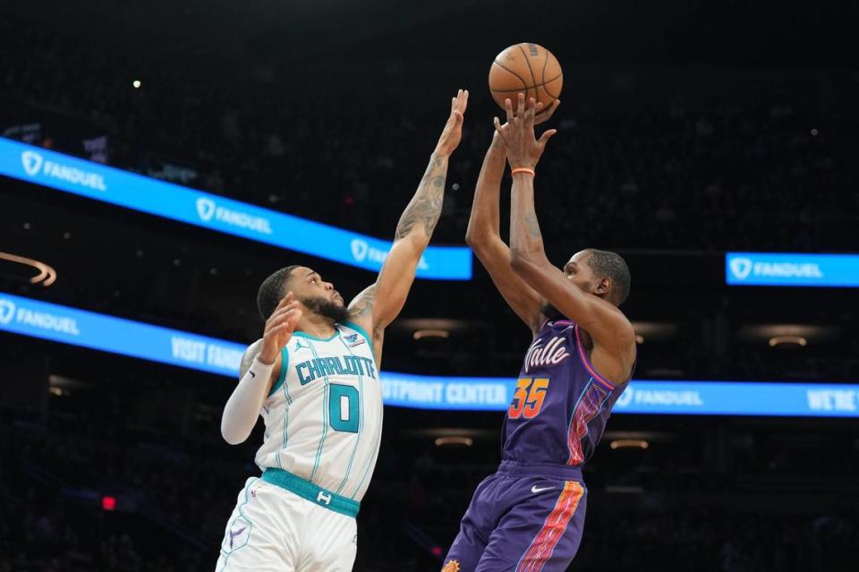 Phoenix Suns forward Kevin Durant (35) shoots over Charlotte Hornets forward Miles Bridges (0) during the second half at Footprint Center.