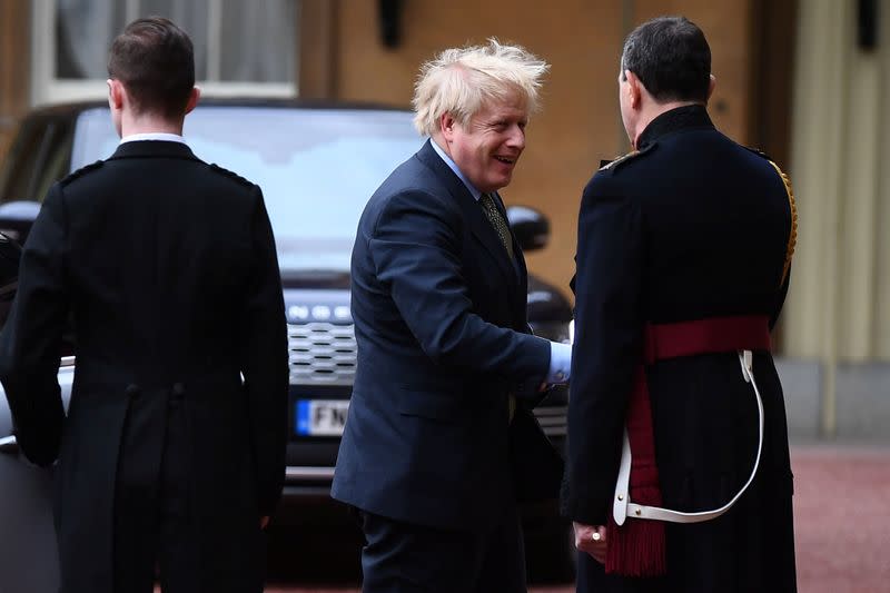 Britain's Prime Minister Boris Johnson arrives at London's Buckingham Palace