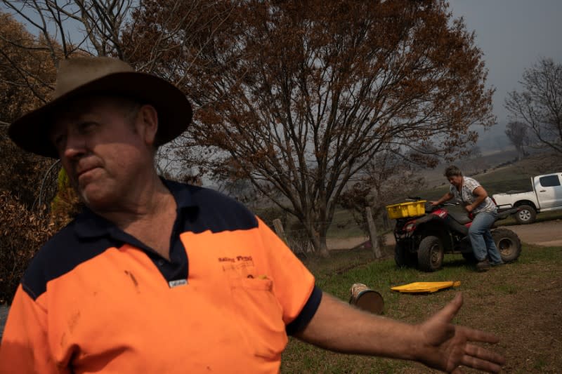 Cattle farmer Warren Salway and his wife are seen in their farm in Wandella