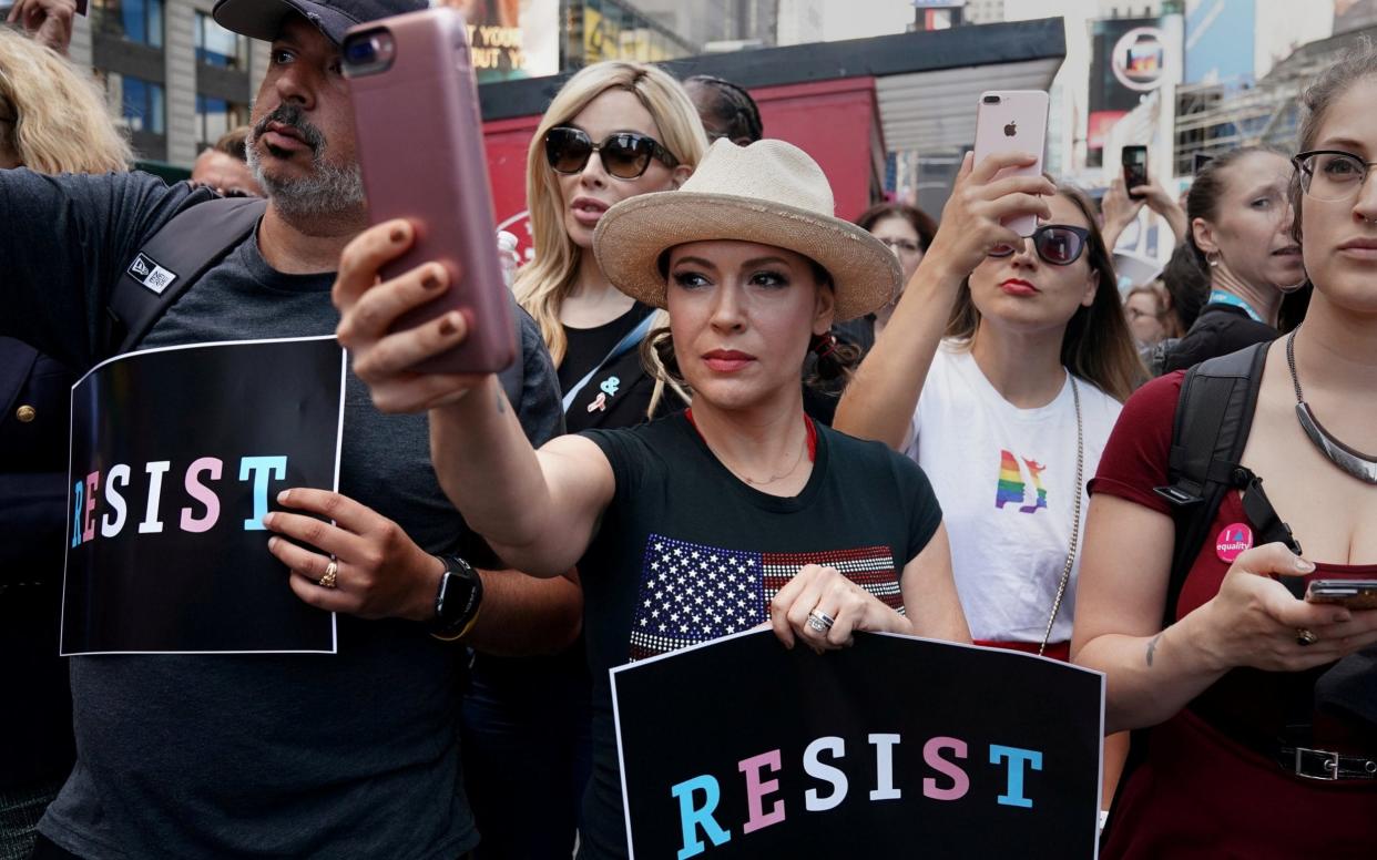 Actress Alyssa Milano attends a protest in Times Square, New York City, New York, U.S., July 26, 2017 - REUTERS