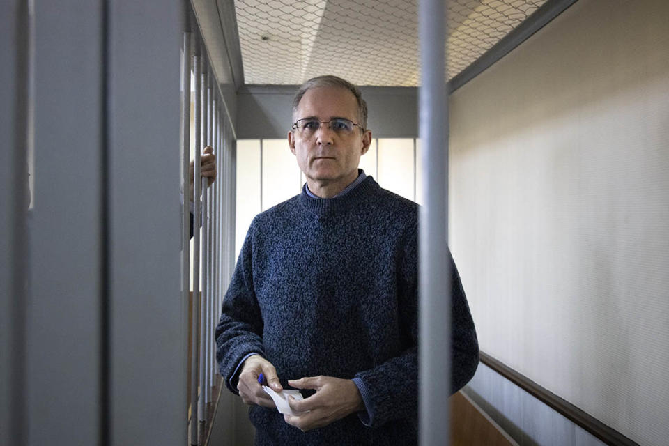 Paul Whelan, a former U.S. marine, who was arrested for alleged spying in Moscow at the end of 2018, stands in a cage while waiting for a hearing in a court room in Moscow, Russia, Friday, Aug. 23, 2019. (AP Photo/Alexander Zemlianichenko)