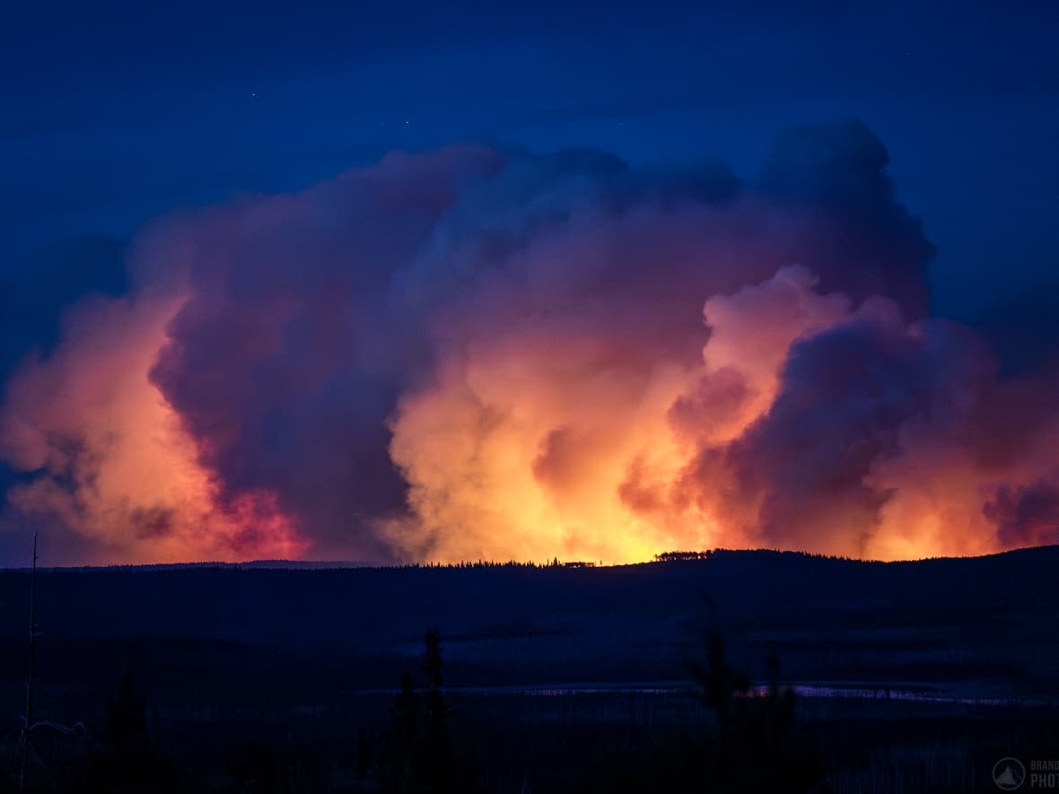 The West Kiskatinaw River wildfire is shown burning near Tumbler Ridge, B.C., on June 6, shortly before midnight. (Brandon Broderick/Submitted - image credit)