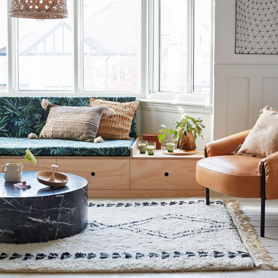 Upholstered window seat with storage drawers