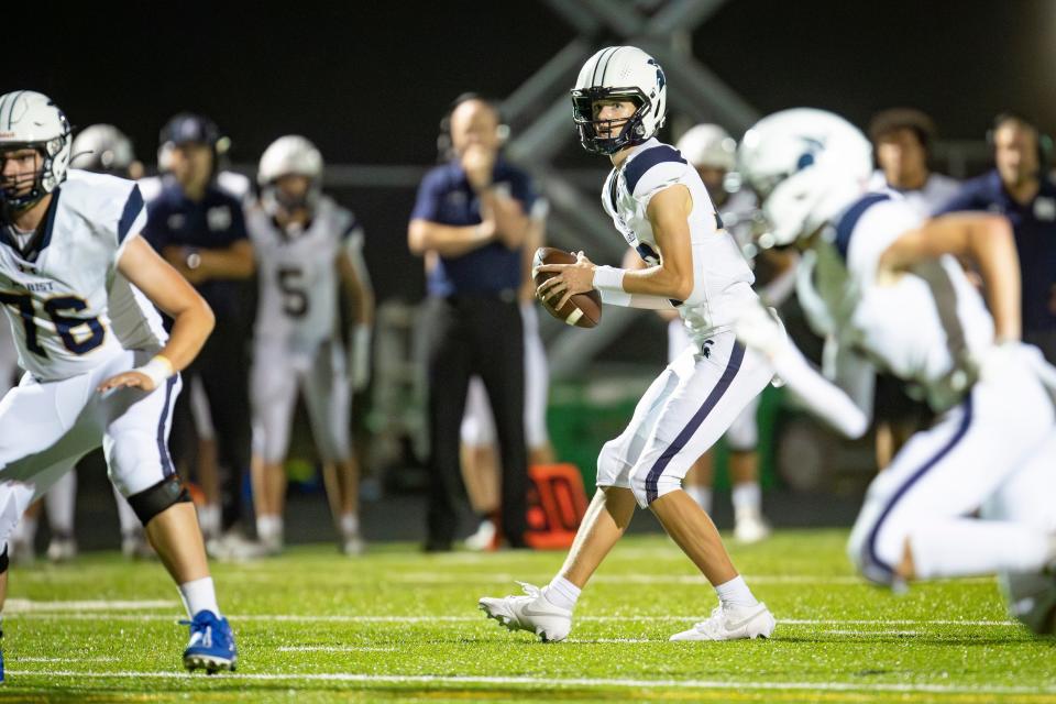 Marist quarterback Nick Hudson looks to pass as the Marist Spartans defeated the Churchill Lancers 36-35 in overtime Friday, Sept. 1, 2023, at Churchill High School in Eugene.