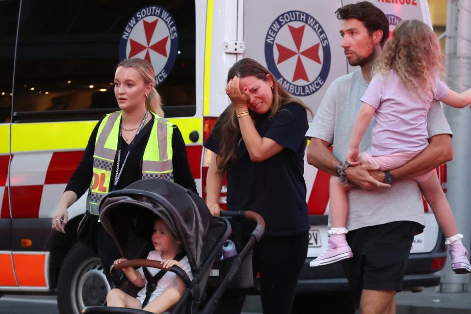 A woman cries as she comes out of the Westfield Bondi Junction shopping mall after a stabbing incident in Sydney on April 13, 2024 (AFP via Getty Images)