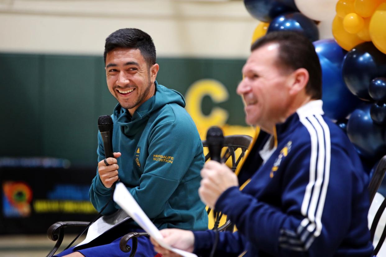 LA Galaxy midfielder Memo Rodríguez, left, and LA Galaxy broadcaster Joe Tutino visit with Coachella Valley Unified School District migrant student athletes at Coachella Valley High School in Thermal, Calif., on Monday, Feb. 13, 2023. 