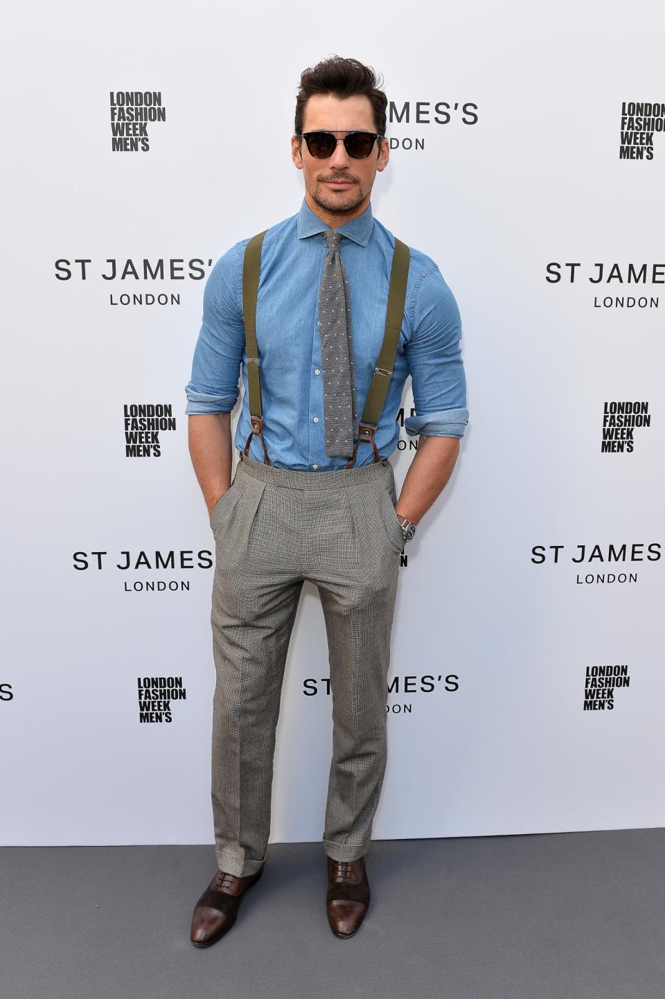 <p>The A-lister rocked braces and sunnies for the outdoor fashion show on day two of London Fashion Week Men’s. <br><em>[Photo: Getty]</em> </p>