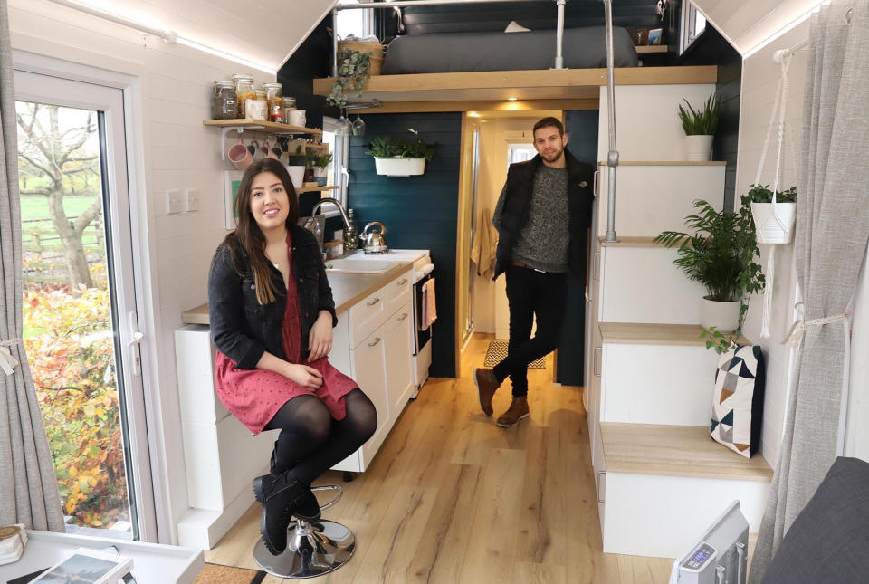 Grace Stringer and her partner Craig Jukes are thrilled with their tiny house. (Caters)