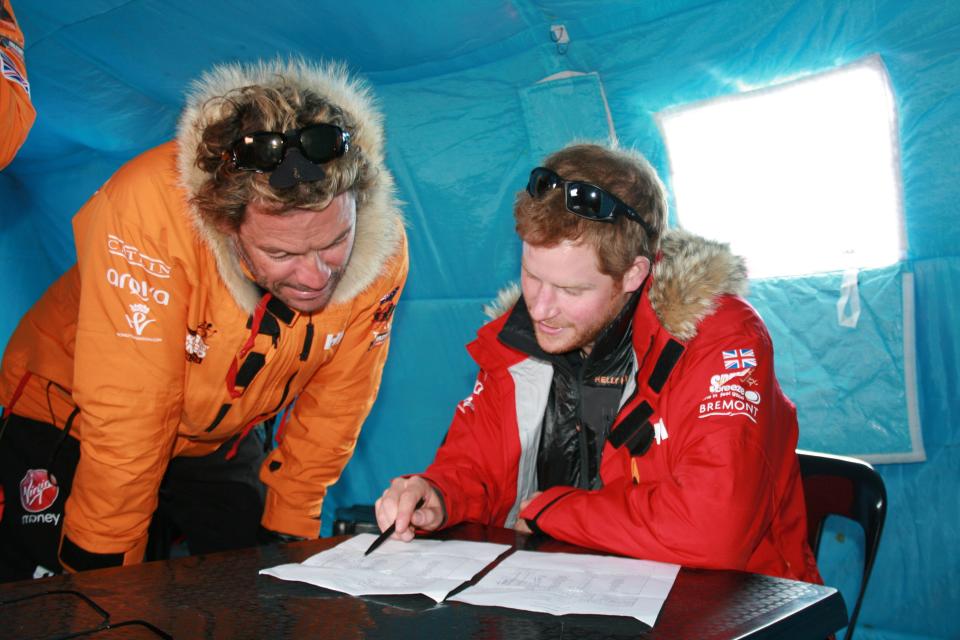 Prince Harry and Dominic West make notes during preparations for their journey in Novo, Antarctica.