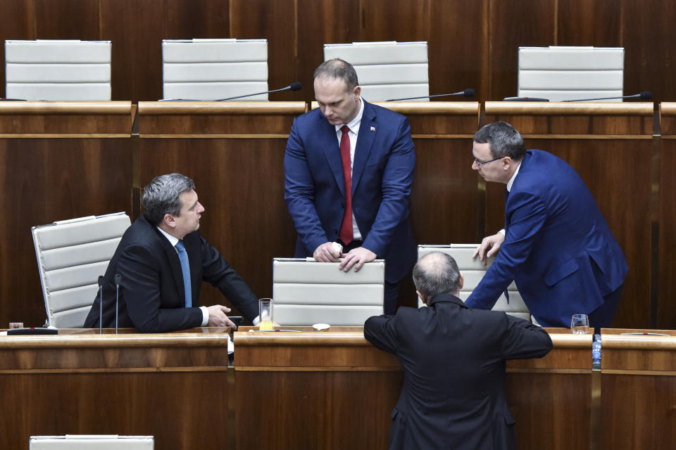 From left, Parliamentary Chair Andrej Danko (SNS), MP Radovan Balaz (SNS), MP Tibor Bernatak (SNS) during a Parliamentary session in Bratislava, Slovakia, Friday, Nov. 29, 2019. Lawmakers in Slovakia are scheduled to debate a proposed law that would compel women seeking an abortion to first have an ultrasound and listen to the heartbeat of the embryo or fetus, a move many groups have decried as a backward step for women’s rights. The bill was submitted by three members of the conservative Slovak National Party (SNS) who wrote that it is intended “to ensure that women are informed about the current stage of their pregnancy” before having an abortion. (Pavol Zachar/TASR via AP)