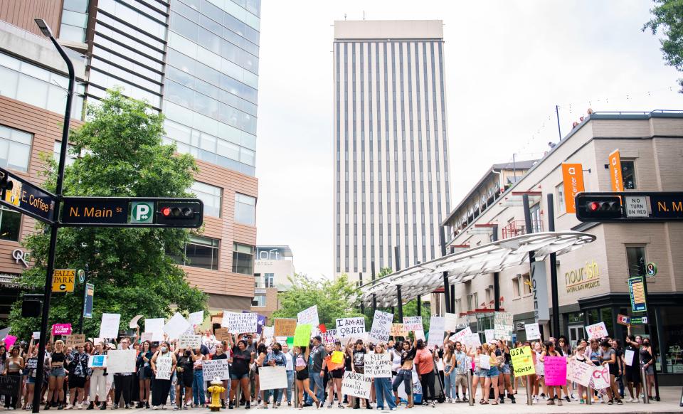 Protesters hold up signs and chant during Bans Off Our Bodies protest in downtown Greenville, Saturday, June 25, 2022. 