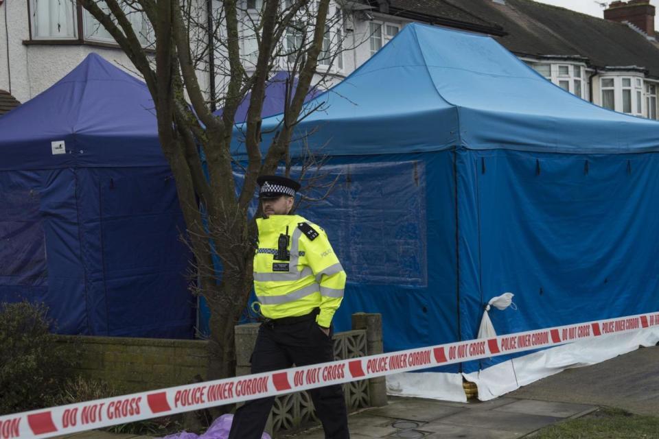 A police officer outside the scene of a property where the body of Russian businessman Nikolai Glushkov was found (EPA)