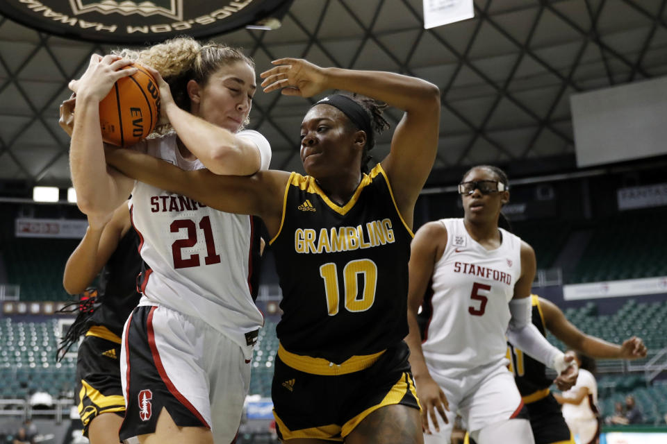 Stanford forward Brooke Demetre (21) and Grambling State guard Leah Morrow (10) fight for a rebound during the fourth quarter of an NCAA college basketball game, Saturday, Nov. 26, 2022, in Honolulu. (AP Photo/Marco Garcia)