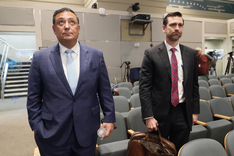 Miami police Chief Art Acevedo and his attorney John R. Byrne, arrive at Miami City Hall for a hearing to determine his job, Thursday, Oct. 14, 2021, in Miami. Acevedo was suspended after a tumultuous six-month tenure. (AP Photo/Marta Lavandier)