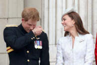Harry makes Kate laugh as they hang out on the balcony during Trooping the Colour at The Royal Horseguards in June 2014 in London. (PA Images)