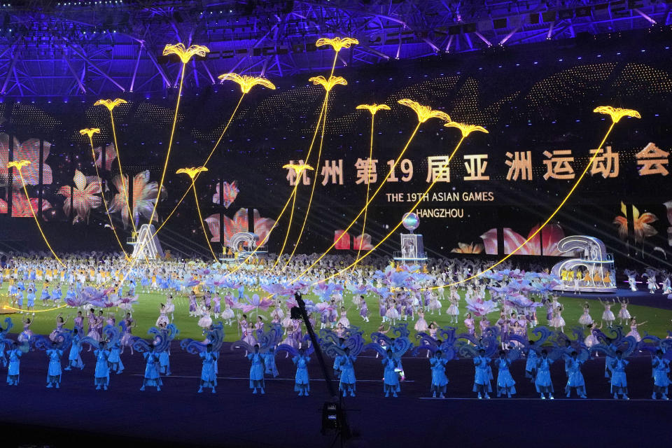 Dancers perform during the closing ceremony of the 19th Asian Games in Hangzhou, China, Tuesday, Jan. 5, 2021. (AP Photo/Aaron Favila)