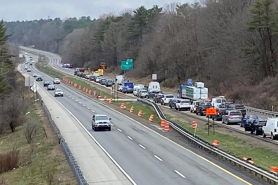 In a still frame from video provided by WGME-TV traffic is backed up near a scene where people were injured in a shooting on Interstate 295, in Yarmouth, Maine, Tuesday, April 18, 2023 (AP)