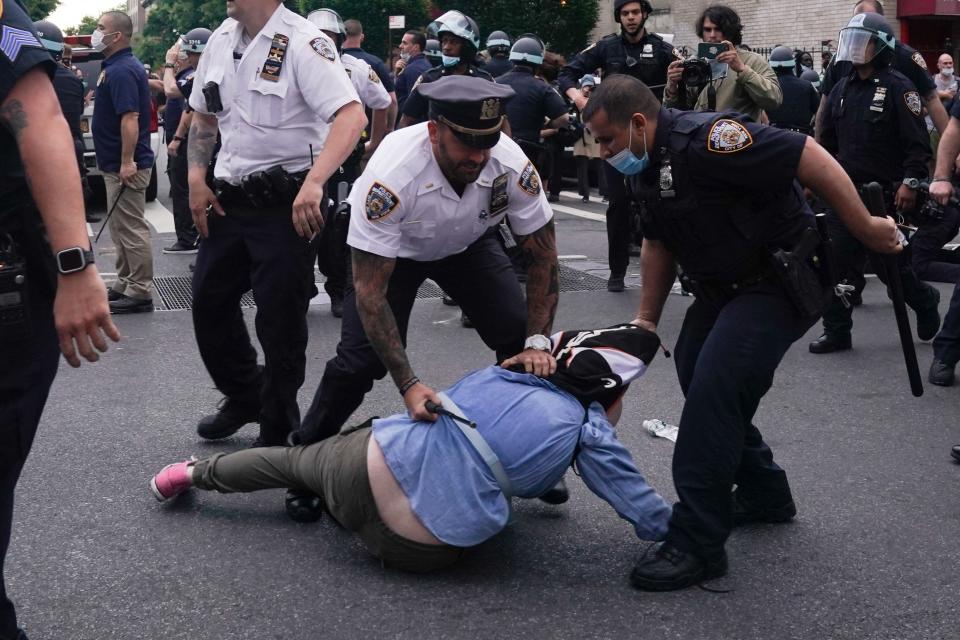 NYPD officers arrest protesters during a demonstration against the killing of George Floyd by Minneapolis police on May 30, 2020 in Brooklyn.74 | Bryan R. Smith/AFP—Getty Images