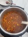 Pot of soup with vegetables cooking in a pot