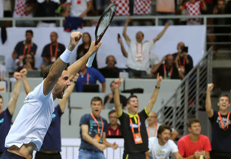 Tennis - Croatia v France - Davis Cup Semi Final - Kresimir Cosic Hall, Zadar, Croatia - 17/9/16 Croatia's Marin Cilic react after winning the men's doubles match against France's Pierre-Hugues Herbert and Nicolas Mahut. REUTERS/Antonio Bronic