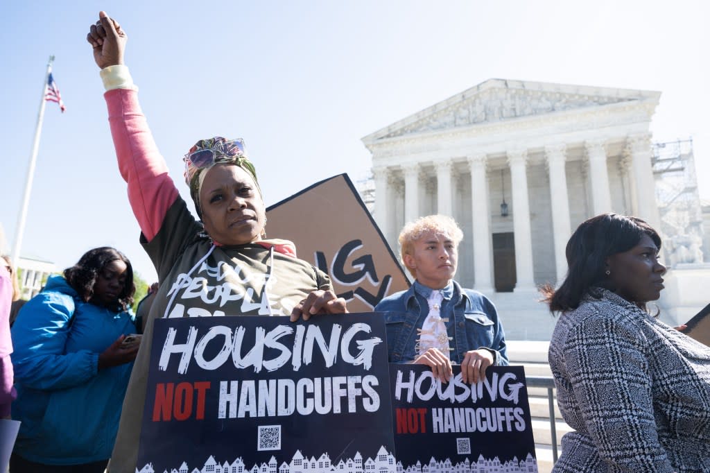 Demonstrators protest outside the US Supreme Court in support of the homeless as the Court hears the case of City of Grants Pass v. Johnson that could make it illegal to sleep outside, in Washington, DC, April 22, 2024. (Photo by SAUL LOEB / AFP) (Photo by SAUL LOEB/AFP via Getty Images)