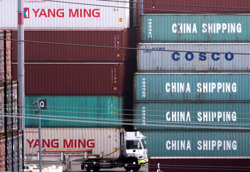 A truck passes by China Shipping containers at the Port of Los Angeles, after new tariffs on Chinese imports was imposed by President Trump, in Long Beach, California on September 1, 2019. - Washington moved ahead Sunday with new tariffs on Chinese imports as it stepped up a high-pressure campaign aimed at coercing Beijing to sign a new trade deal even amid fears of a further slowing of US and world growth. (Photo by Mark RALSTON / AFP)        (Photo credit should read MARK RALSTON/AFP/Getty Images)