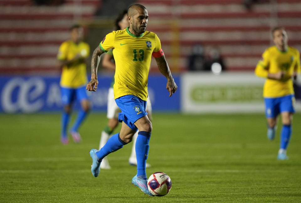FILE - Brazil's Dani Alves goes with the ball during a qualifying soccer match for the FIFA World Cup Qatar 2022 against Bolivia in La Paz, Bolivia, Tuesday, March 29, 2022. (AP Photo/Juan Karita, File)