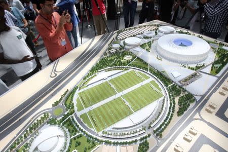 People look at a model of Al Thumama stadium during an unveiling ceremony at Hamad International Airport in Doha, Qatar, August 24, 2017. REUTERS/Naseem Zeitoon