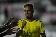 Teammates reach out to congratulate Nashville midfielder Hany Mukhtar after he scored the side's first goal against Inter Miami during the first half of an MLS soccer match, Wednesday, Sept. 22, 2021, in Fort Lauderdale, Fla. (AP Photo/Rebecca Blackwell)