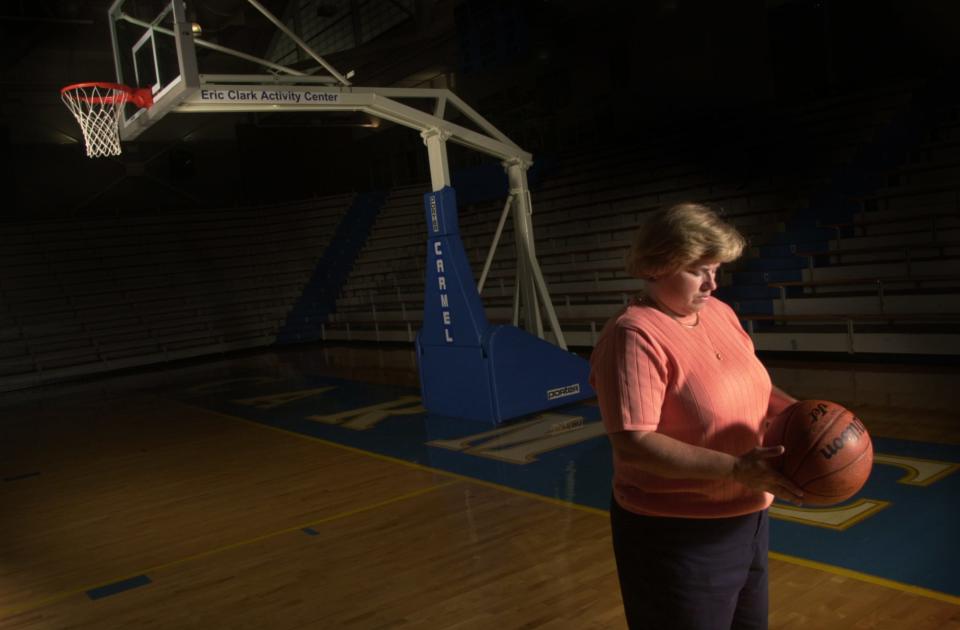 Judi Warren was Indiana's first Miss Basketball in 1976.  She poses in the Carmel High School gym in 2002.