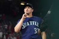 Seattle Mariners relief pitcher Paul Sewald gestures toward the crowd as he forces out Los Angeles Angels' Jose Rojas at first to end the baseball game Friday, Sept. 24, 2021, in Anaheim, Calif. The Mariners won 6-5. (AP Photo/Mark J. Terrill)