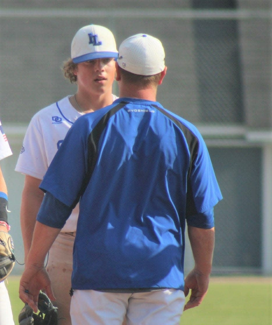 Inland Lakes' Connor Wallace listens to coach Josh Vieau during a regional game against Rudyard last season. Both the player and coach have a goal of reaching East Lansing in the postseason.