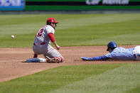 Kansas City Royals Andrew Benintendi (16) steals second base as the ball gets past Los Angeles Angels second baseman David Fletcher (22) during the first inning of a baseball game at Kauffman Stadium in Kansas City, Mo., Wednesday, April 14, 2021. Benintendi advanced to third base on the play. (AP Photo/Orlin Wagner)