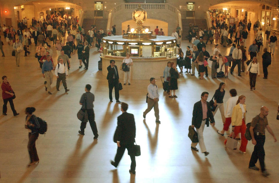 Commuters walk through the main concourse of Grand Central Terminal during morning rush hour, Monday, Aug. 18, 2003, in New York. The morning commute went as planned with no major problems for millions of people on their way to work on the first Monday after last week's blackout. (AP Photo/Mary Altaffer)