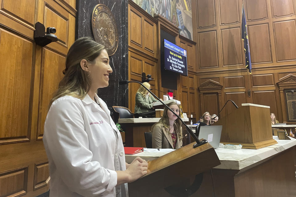 Dr. Beatrice Soderholm, a fourth-year obstetrics and gynecology resident at Indiana University, speaks to a House committee on Tuesday, Aug. 2, 2022, in Indianapolis. Soderholm and her fellow residents are concerned about practicing medicine in Indiana if a more restrictive abortion ban becomes law. (AP Photo/Arleigh Rodgers)