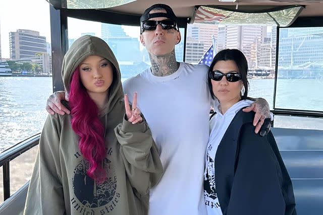 <p>Travis Barker/Instagram</p> From left: Alabama Barker, Travis Barker and Kourtney Kardashian pose on a boat.