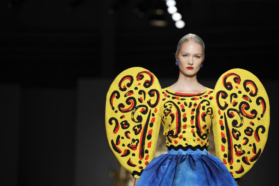 A model wears a creation as part of the Moschino Spring-Summer 2020 collection, unveiled during the fashion week, in Milan, Italy, Thursday, Sept. 19, 2019. (AP Photo/Luca Bruno)