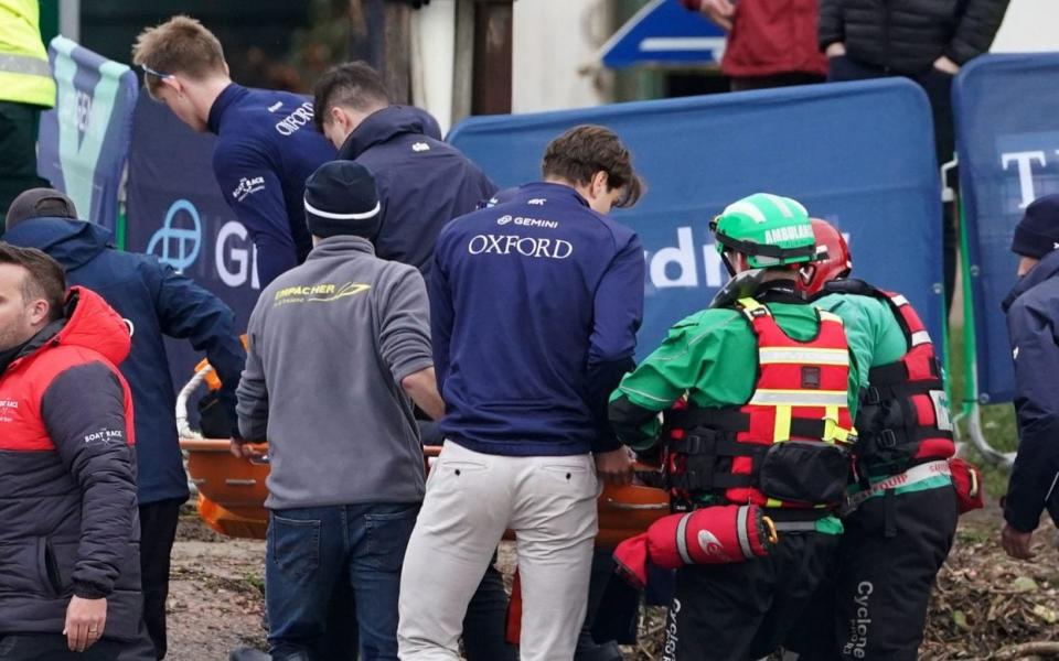 Oxford's Felix Drinkall is carried away on a stretcher after the men's race following the 168th Men's Gemini Boat Race 2023 on the River Thames - Oxford rower Felix Drinkall collapses after Cambridge victory - PA/Joe Giddens