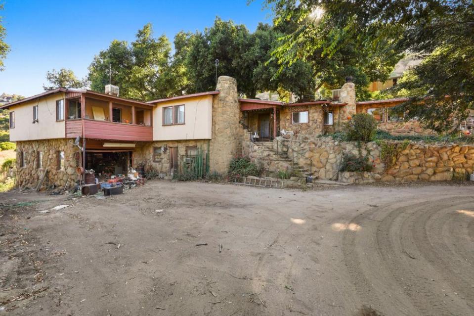 The exterior of an outbuilding that a buyer can scoop up. Holly & Chris Luxury Homes Group, Coldwell, Banker Calabasas