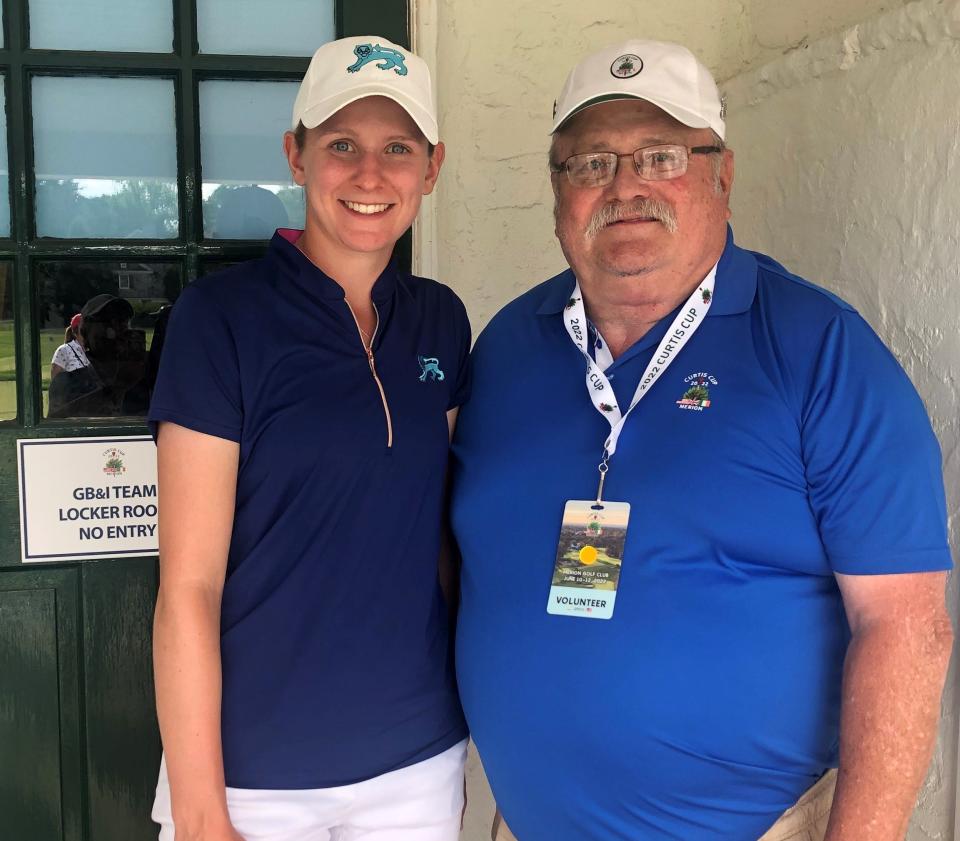 David Benjamin, right, of Aurora, visited with Kent State golfer Emily Price during the Curtis Cup in Ardmore, Pa.