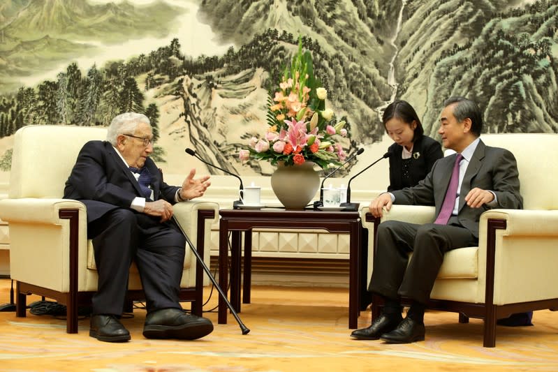 Chinese Foreign Minister Wang Yi meets former U.S. Secretary of State Henry Kissinger in Beijing